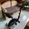 Stationary exercise bike in a living room (illustrative photo)
