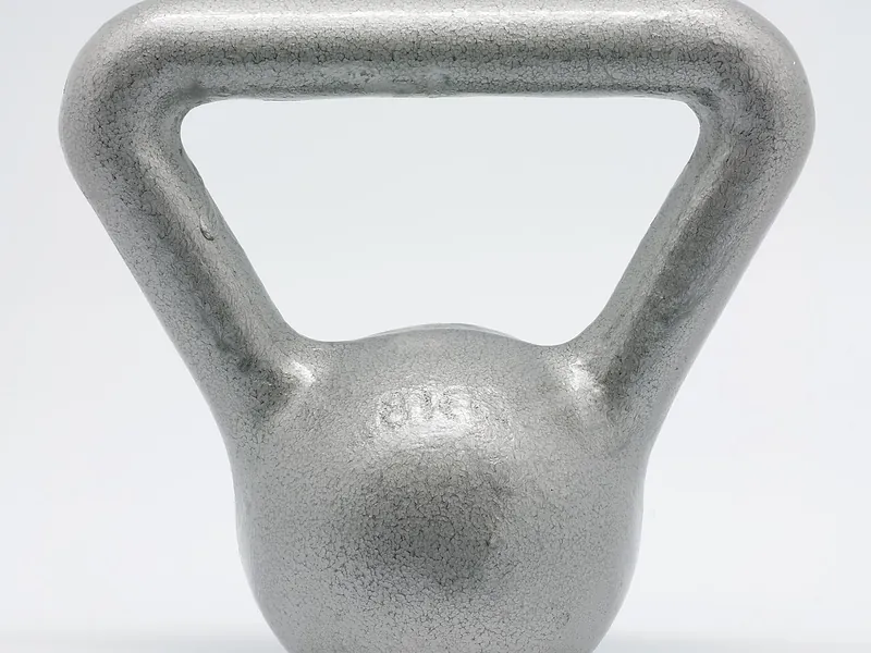 Single cast-iron kettlebell on a white background (illustrative photo)