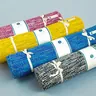 Four rolled yoga mats tied with cord (illustrative photo)